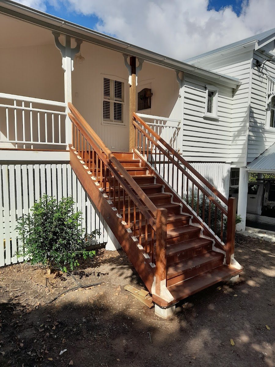 Solid timber external staircase and balustrade leading to a Queenslander verandah