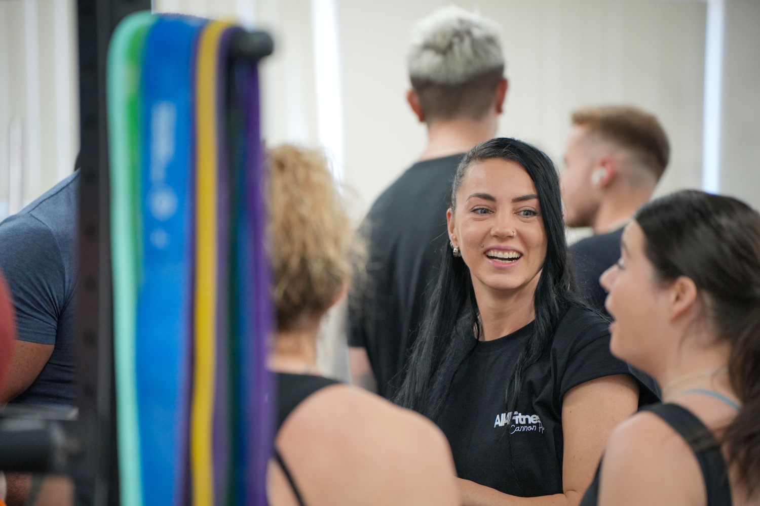 A smiling member in the gym