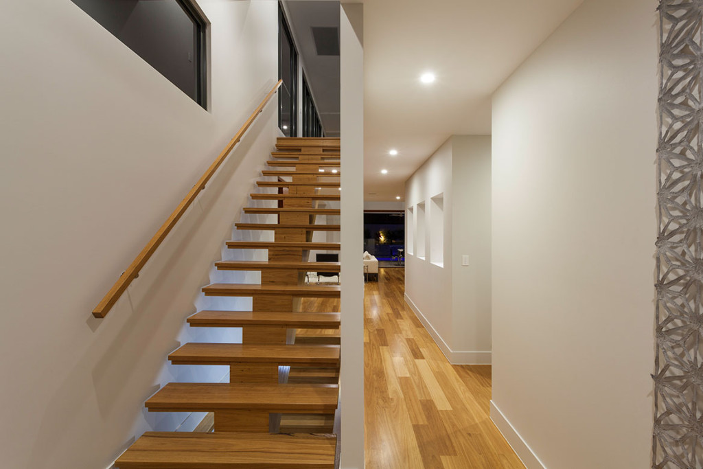 Modern home interior staircase featuring quality lighting installation