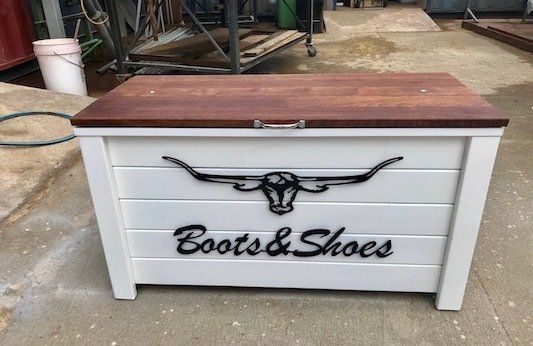 White timber boots and shoes storage chest with a brown top