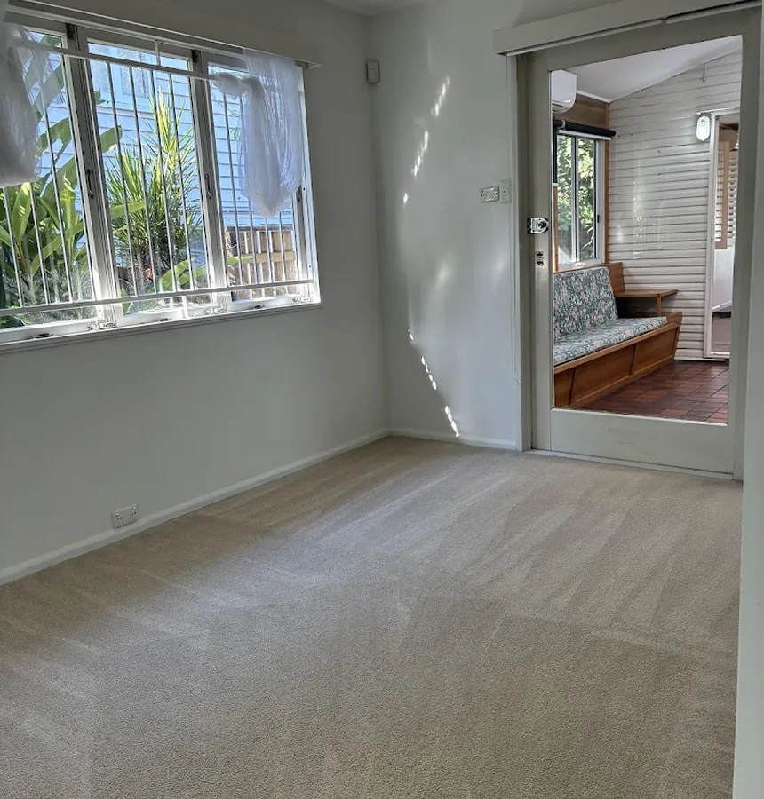 Freshly steam-cleaned carpet with crisp vacuum lines in a Brisbane home