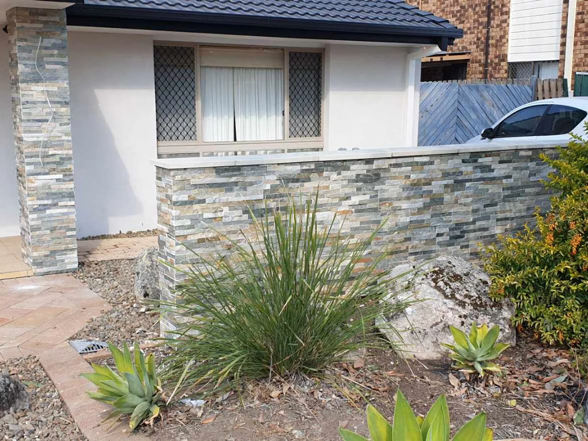 Stone-clad home exterior renovation