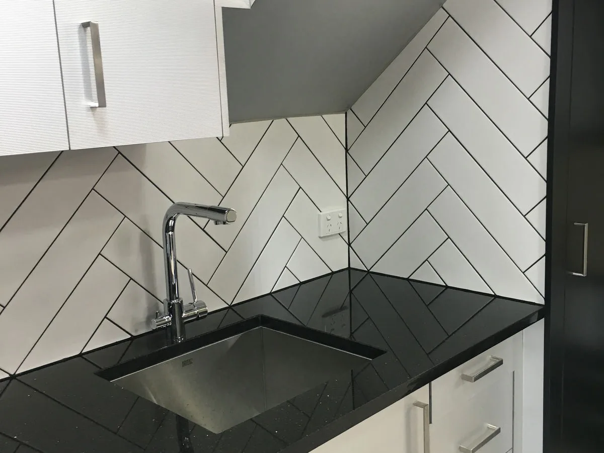 Herringbone kitchen splashback tiling