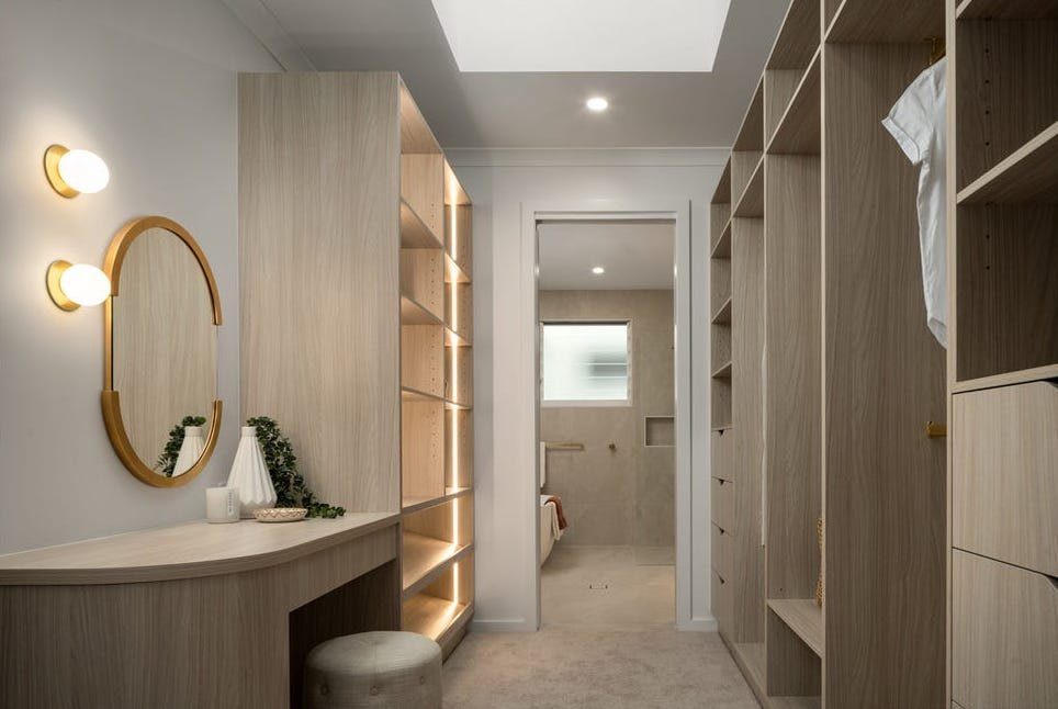 Walk-in robe with under-shelf LED lighting by Briselec