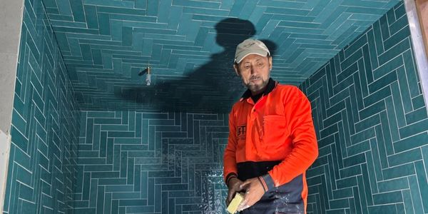 Zaki, owner and lead tiler at Brisy Tiling, on site during a bathroom tiling job