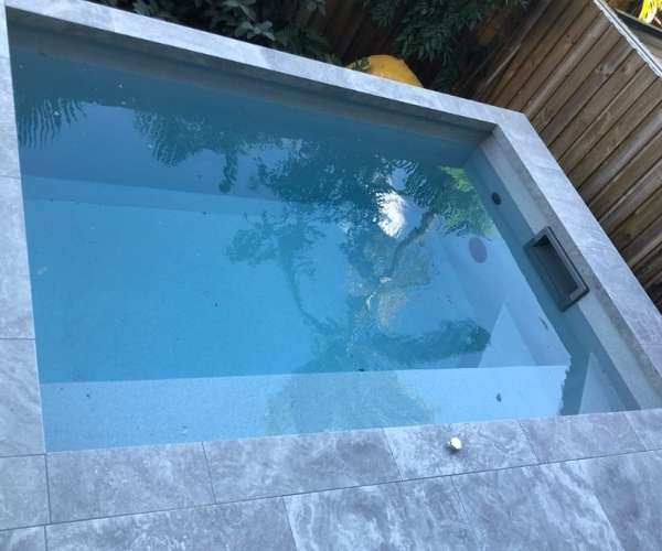 Pool waterline and surround tiling by Brisy Tiling