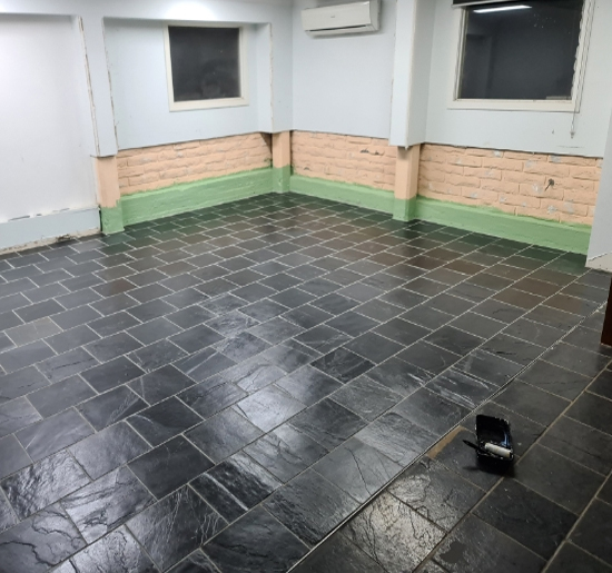 Outdoor tiled floor completed by Brisy Tiling
