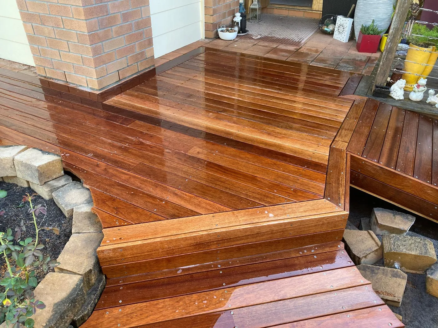 Wet polished hardwood deck steps and entry by C3L Carpentry & Joinery