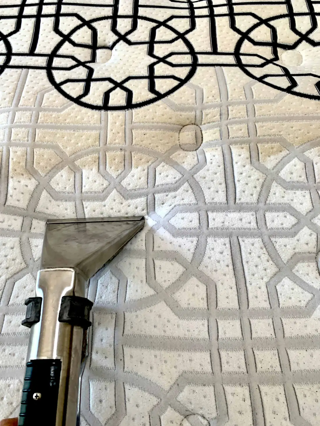 Steam cleaning wand leaving a visibly cleaner stripe on a mattress in Moorooka