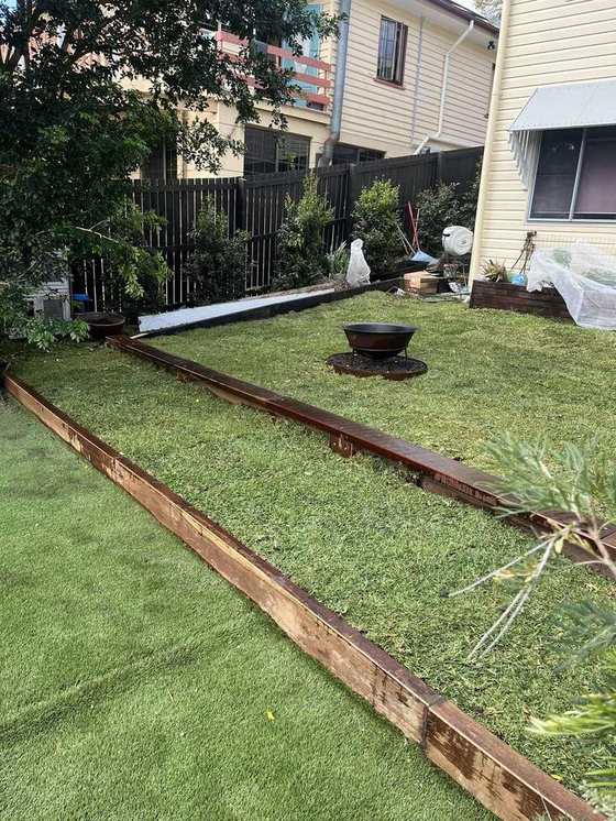 Sleeper garden edging and fresh turf by Dawson Landscapes