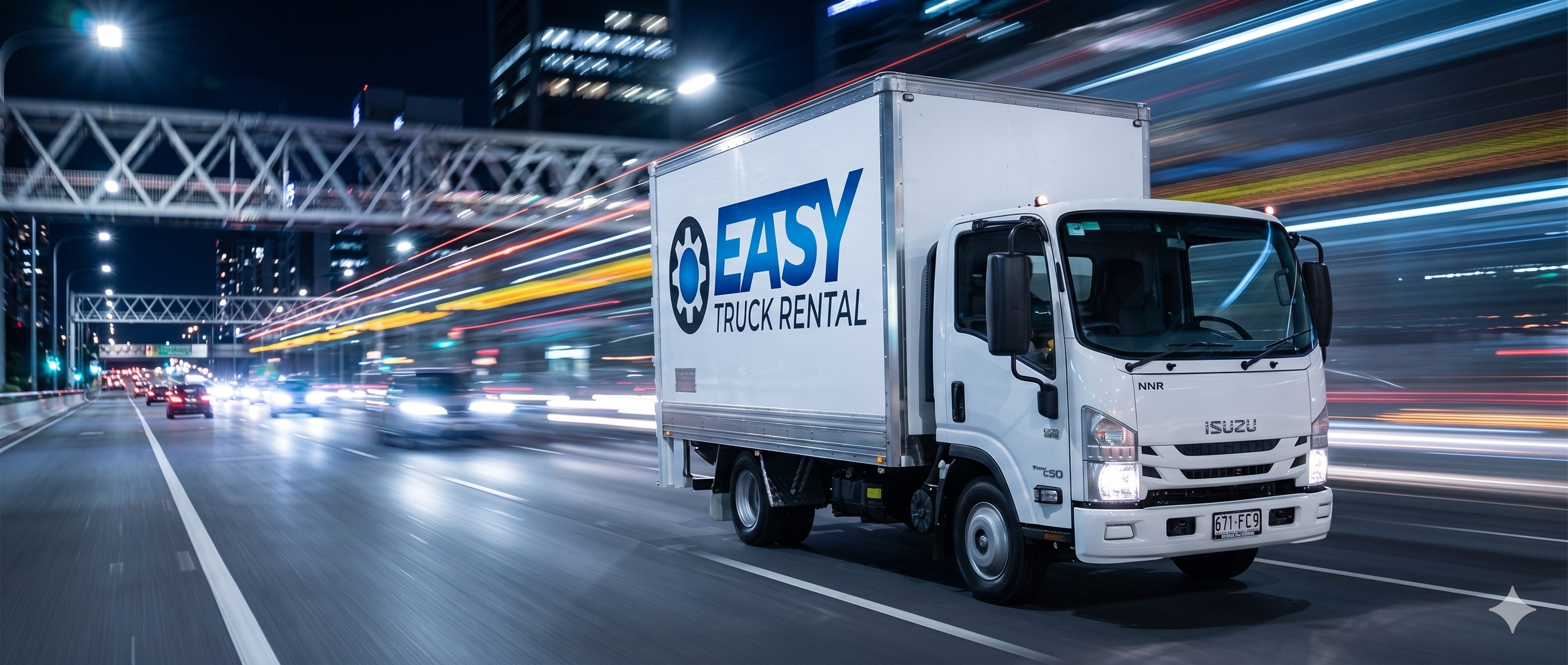 Easy Truck Rental Pantech 3T at speed across the Brisbane River bridge at night, motion-blur light trails behind