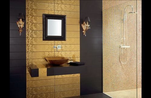 Black and gold luxury bathroom with patterned feature tiling and mosaic shower