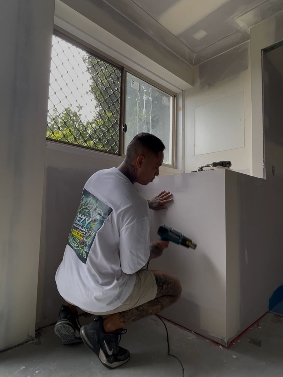 Ezy Maintenance Repairs patching and painting a wall