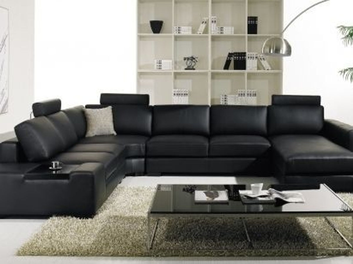 A black leather modular lounge in a modern living room