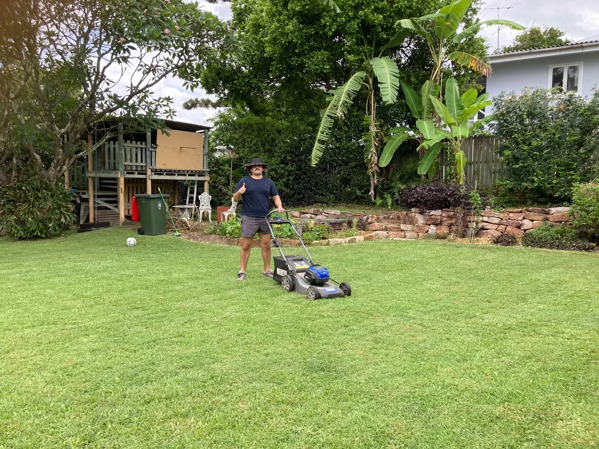 A clean, leaf-free backyard lawn maintained by JT’s Gardening