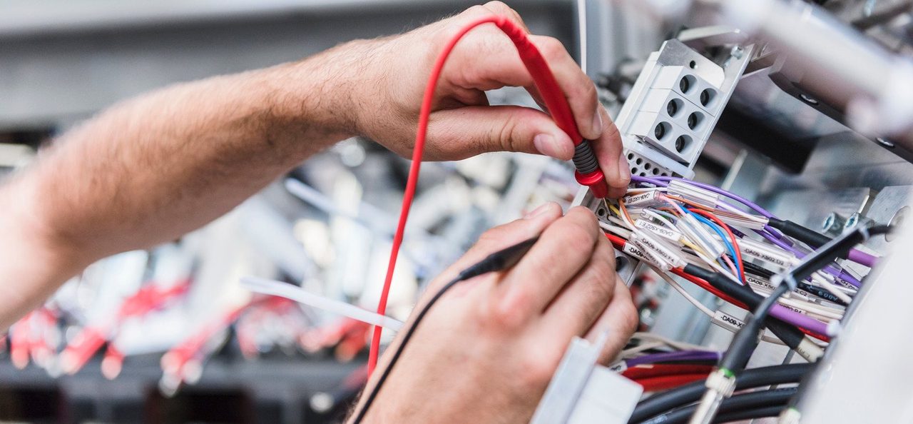 Master Electrician testing a switchboard