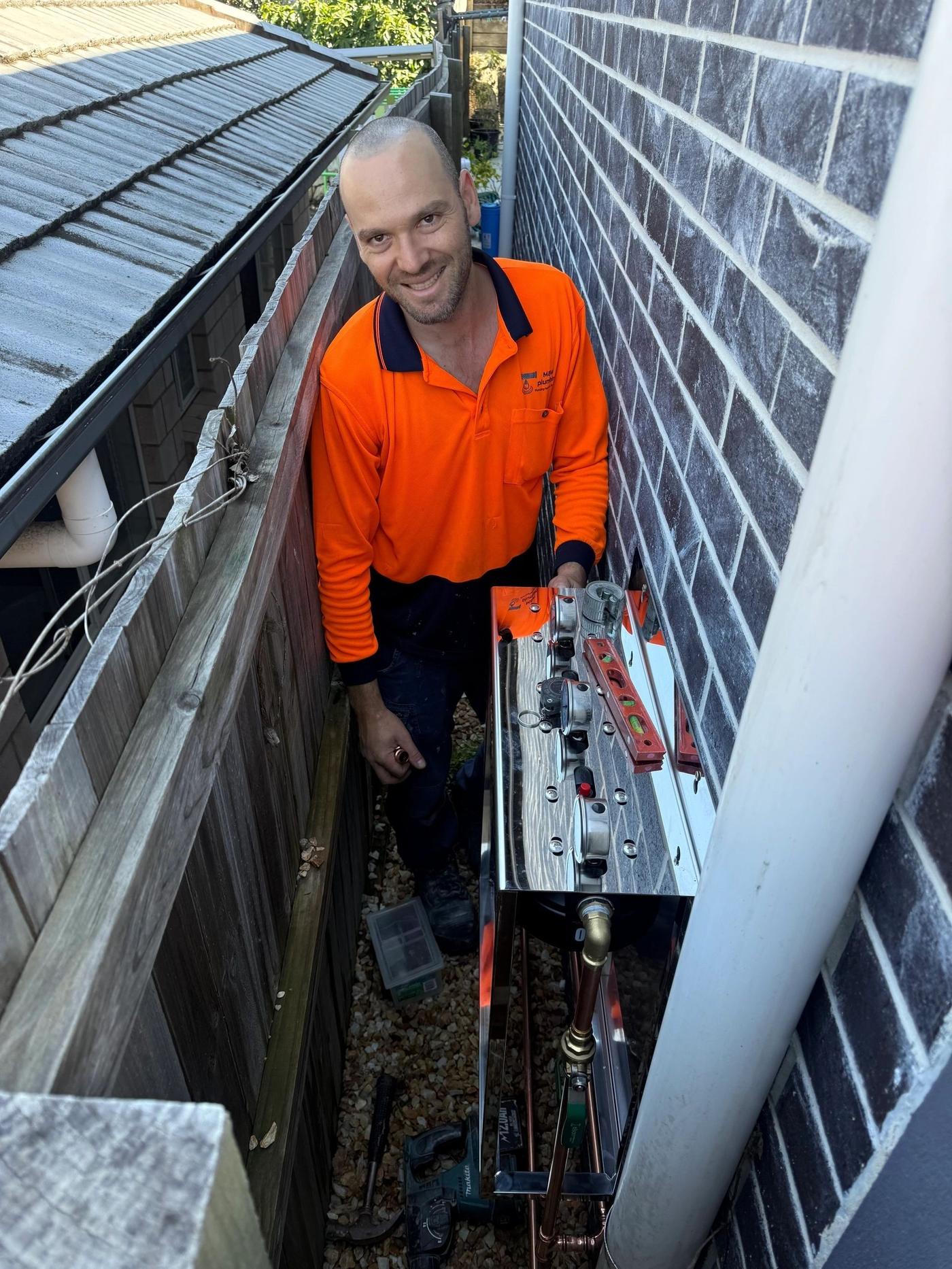 M&W Plumbing plumber on a Brisbane job site