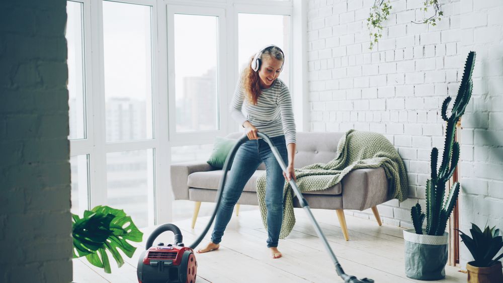 Vacuuming a bright, modern living room