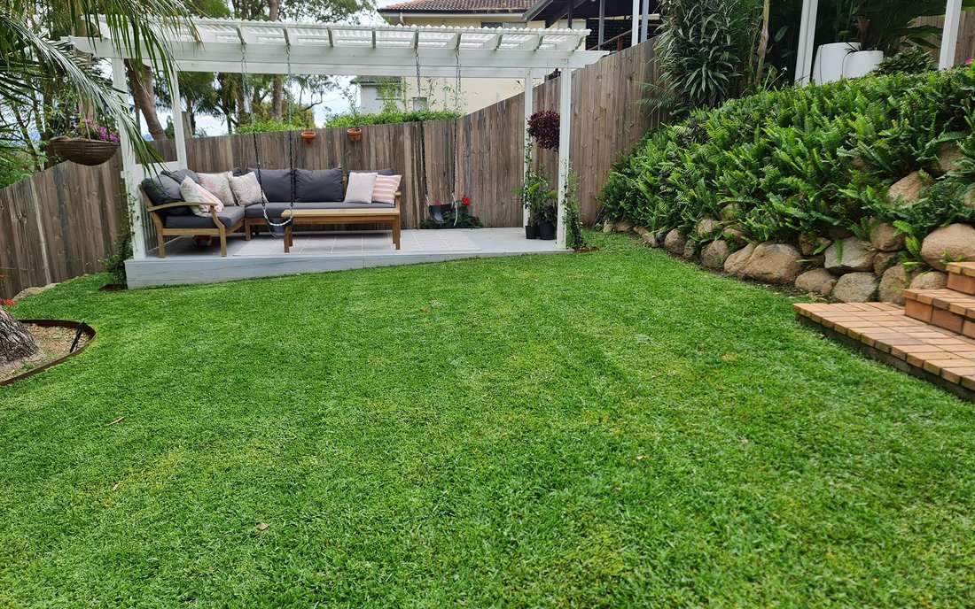 A freshly mowed Brisbane backyard lawn by Mitch's Mowing and Landscaping
