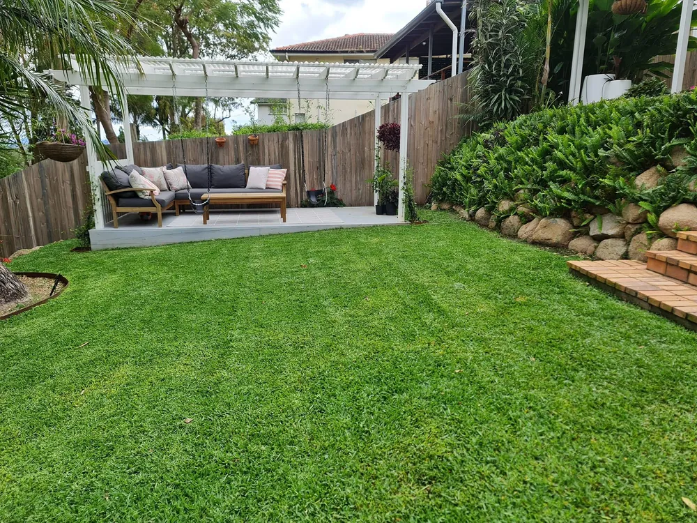 Tidy garden beds and lawn at a Coorparoo home