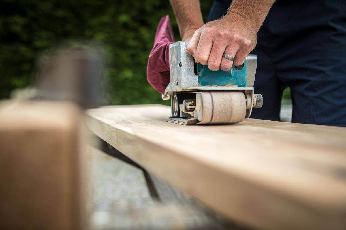 MJN Carpentry tradesman sanding timber