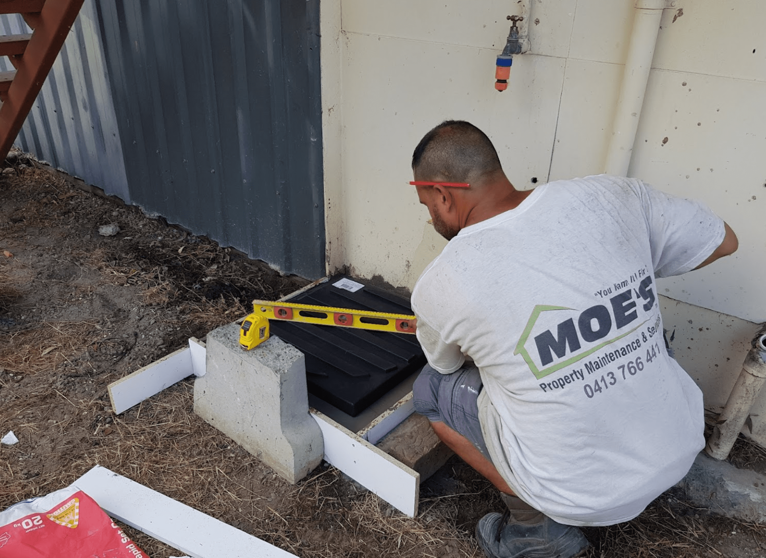 Moe carrying out property maintenance work