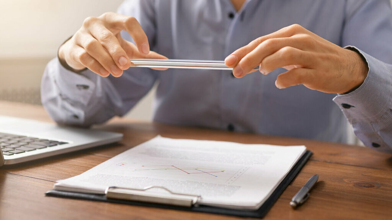Photographing a document flat on a surface with a smartphone for a loan application