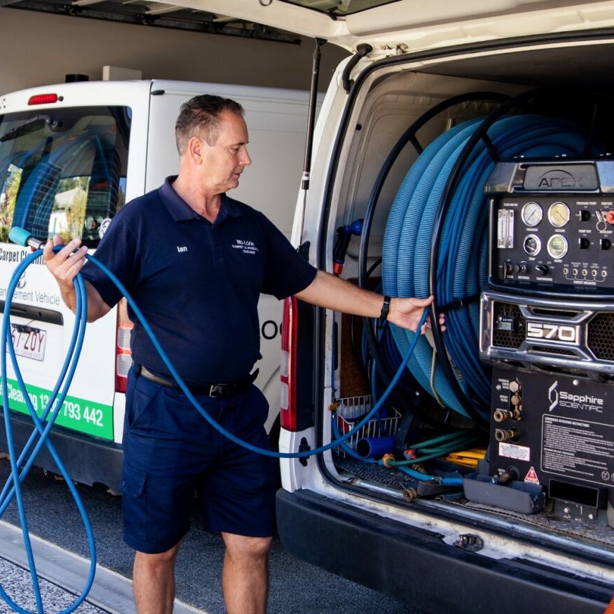 Nu-Look technician setting up cleaning equipment from the van