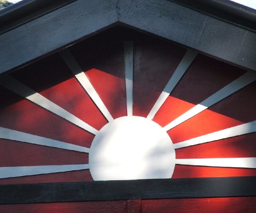 Painted sunburst gable feature