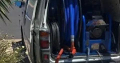 The Pest N Carpet service van loaded with carpet-cleaning equipment