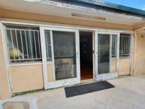 Timber and glass doors before restoration