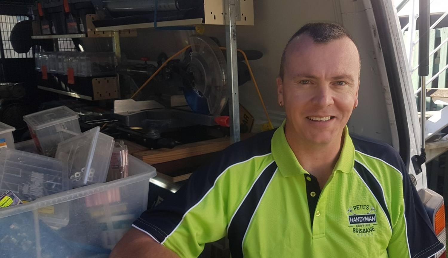 Pete Barton beside his stocked handyman service van