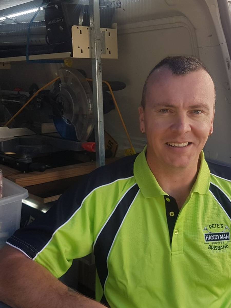 Pete Barton beside his stocked handyman service van