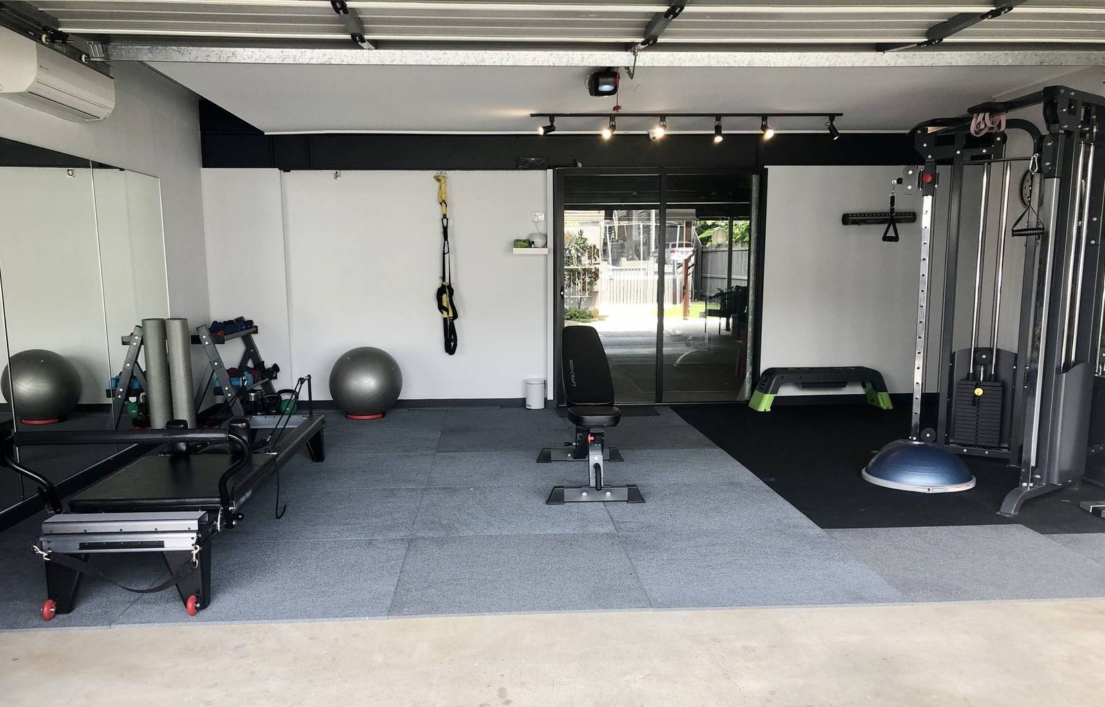 Calm Pilates studio with reformer equipment