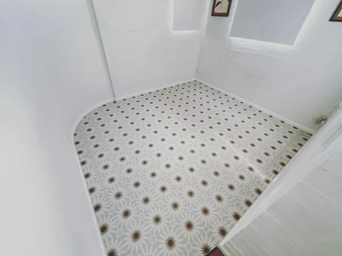 Patterned feature floor tile in a heritage-style room