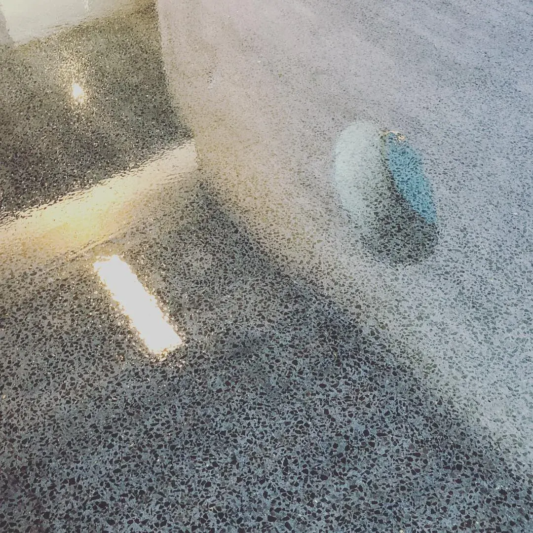 Polished concrete flooring with a stone-speckle finish