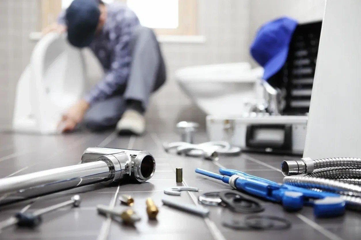 RLM Plumbing Contractors plumber at work in a Brisbane bathroom