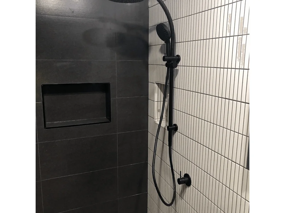 Modern shower renovation with black tapware