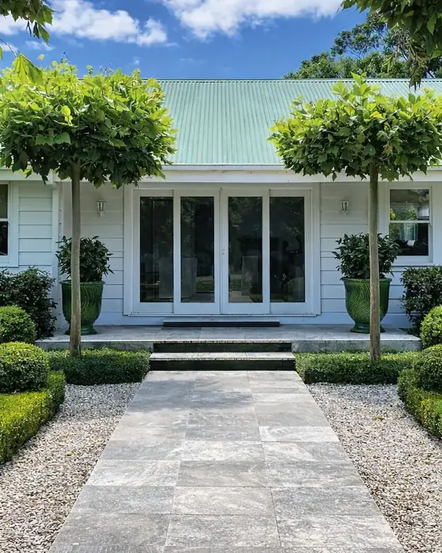 A north-Brisbane property with hedging and lawn maintained by Selva Lawns & Gardens