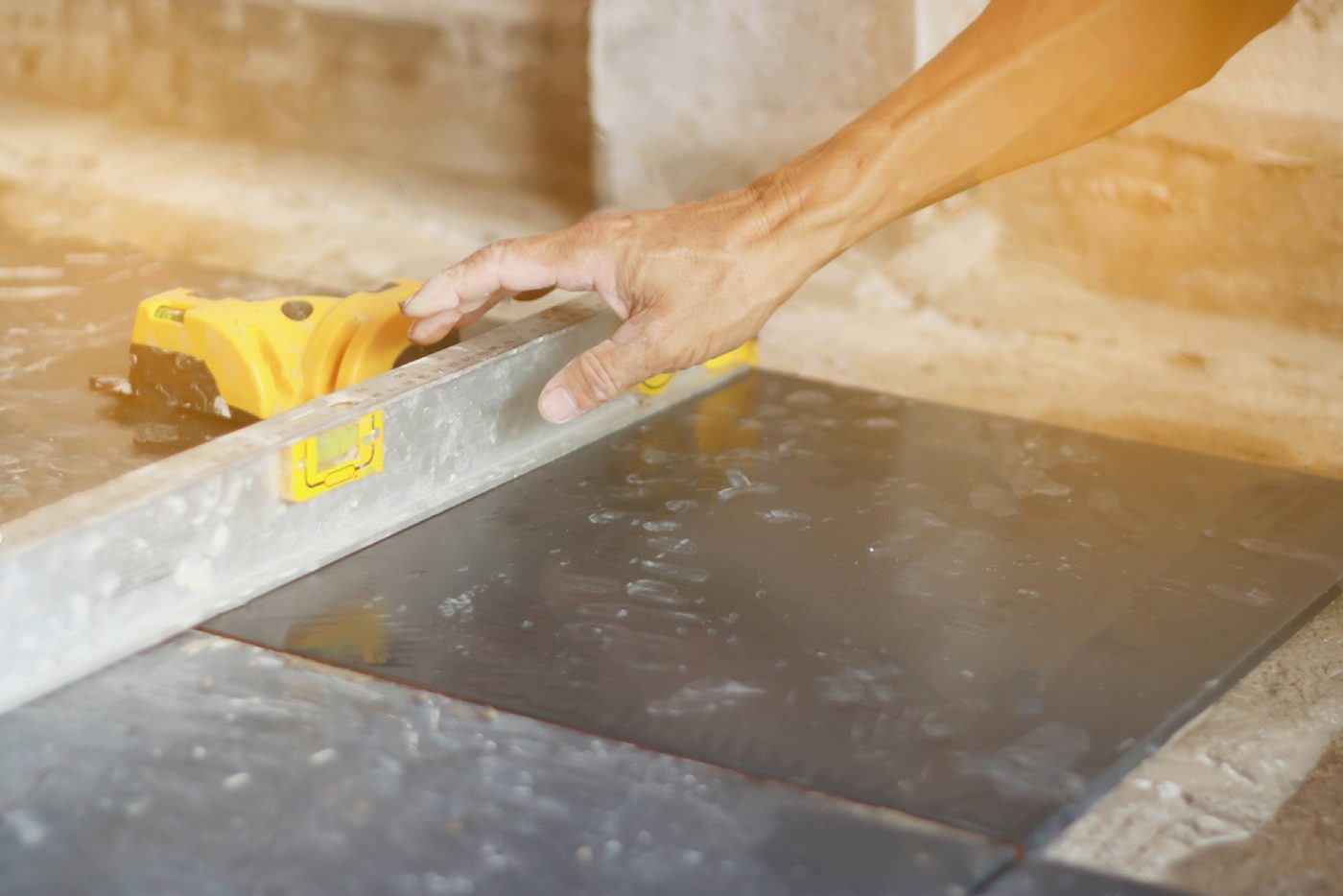 A SEQ Tiling tradesman tiling on site