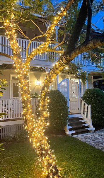 Queenslander home with festoon and tree lighting installed by Sneyd Electrical, Paddington Brisbane