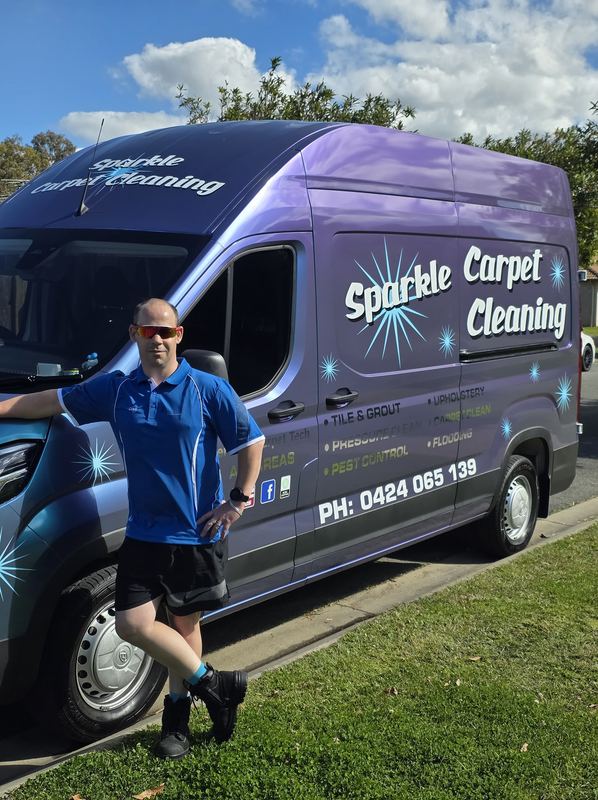 Craig from Sparkle Carpet Cleaning with his branded van