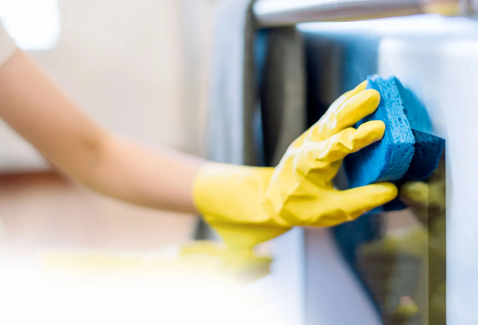 A Sparkling Noosa cleaner detailing a kitchen surface