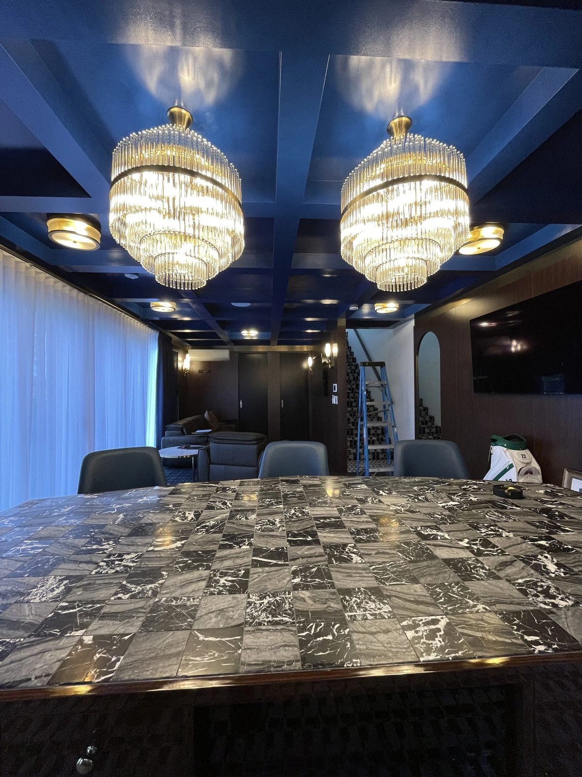 Crystal chandeliers installed by Sparky Marc in a Brisbane dining room