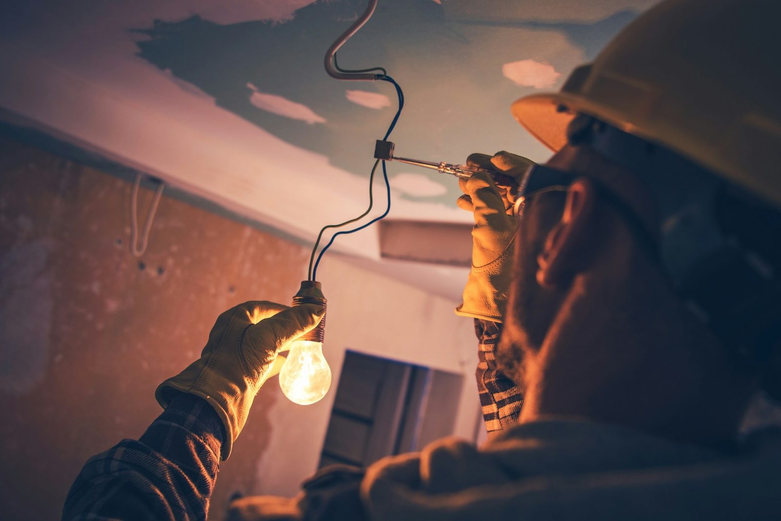 Licensed electrician working on lighting in a Brisbane home