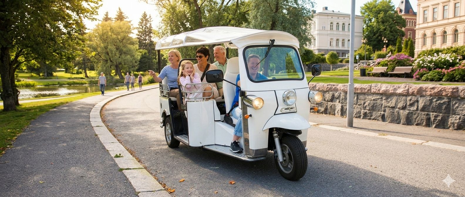 Family riding an electric tuk tuk through a leafy Brisbane park