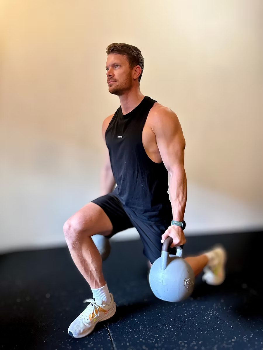 Zac Keune demonstrating a kettlebell lunge